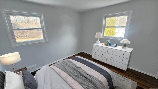 bedroom featuring dark hardwood / wood-style floors