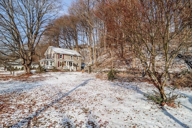 view of yard covered in snow