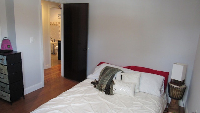 bedroom featuring dark hardwood / wood-style floors