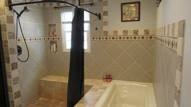 bathroom with a tile shower