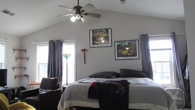 bedroom with multiple windows, vaulted ceiling, and ceiling fan