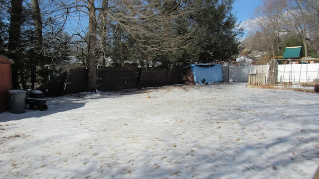 view of yard layered in snow