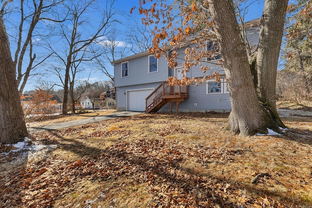 rear view of property with a garage