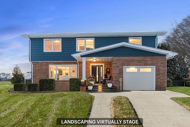 front of property featuring a porch, a yard, and a garage