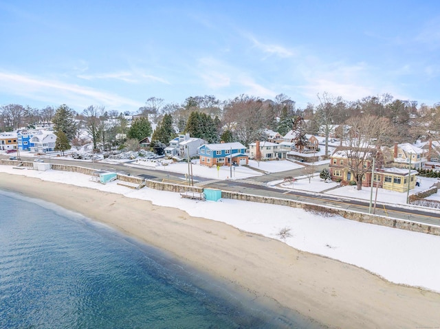 aerial view featuring a view of the beach and a water view