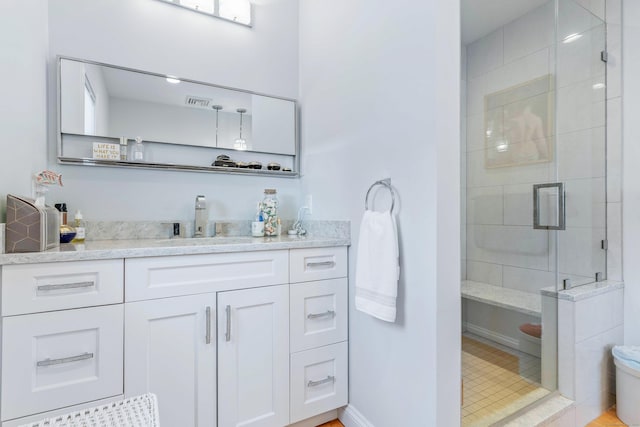 bathroom with vanity and an enclosed shower