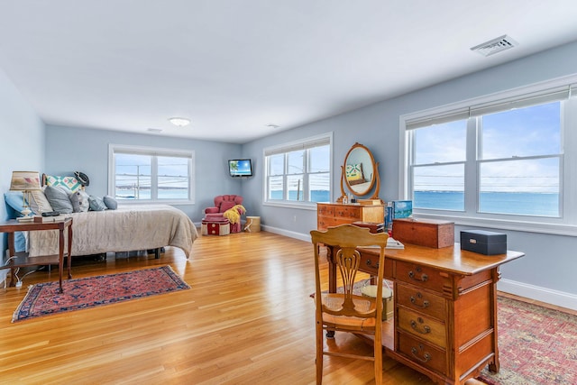 bedroom with light wood-type flooring