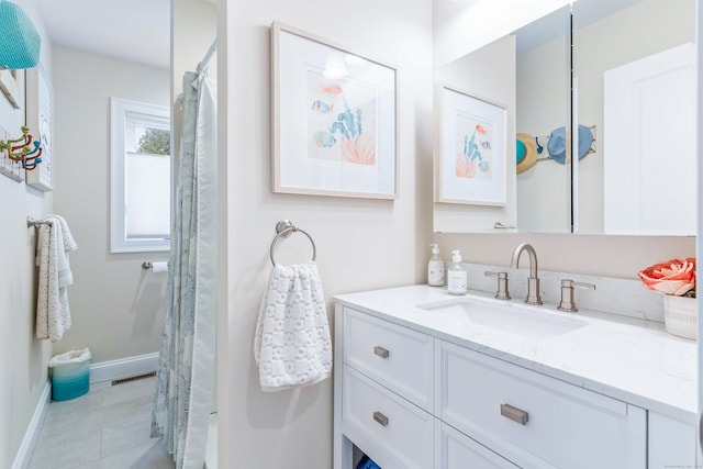 bathroom featuring tile patterned floors and vanity