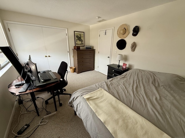 carpeted bedroom with a textured ceiling