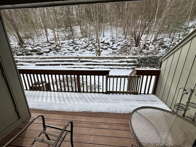 view of snow covered deck