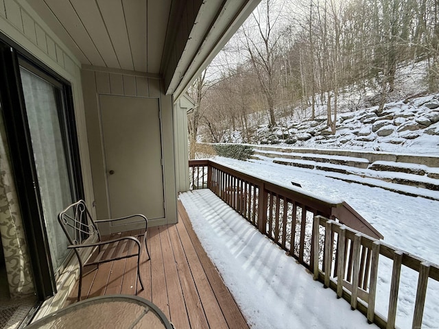 view of snow covered deck