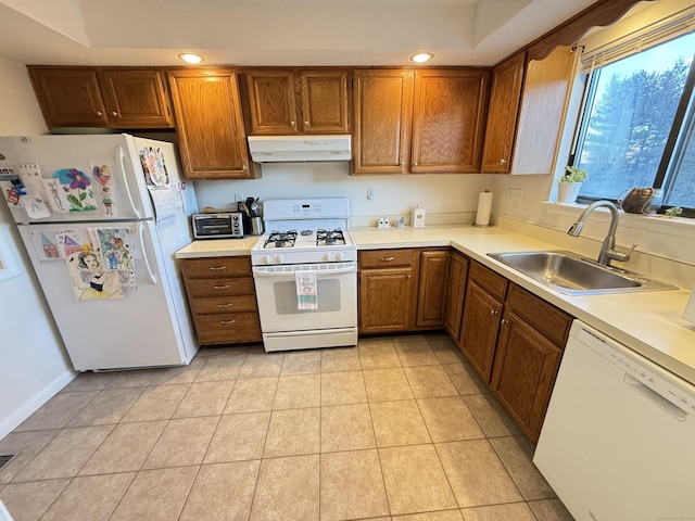 kitchen featuring sink, light tile patterned floors, and white appliances