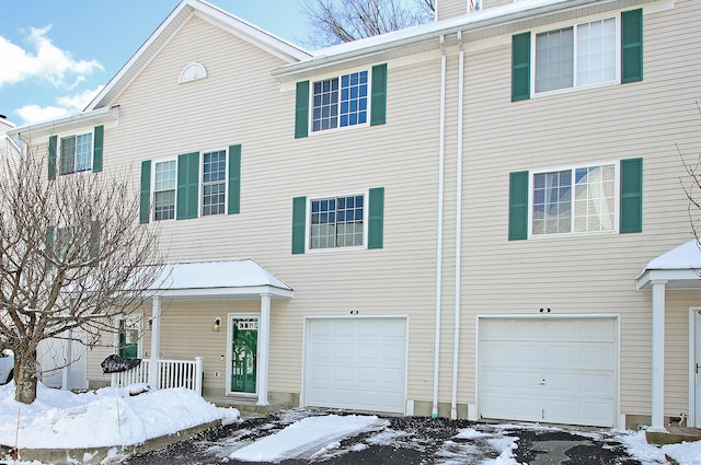 view of front of home with a porch and a garage