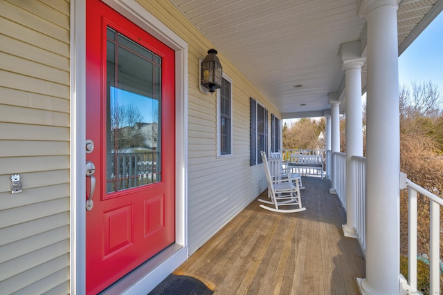 doorway to property featuring a porch