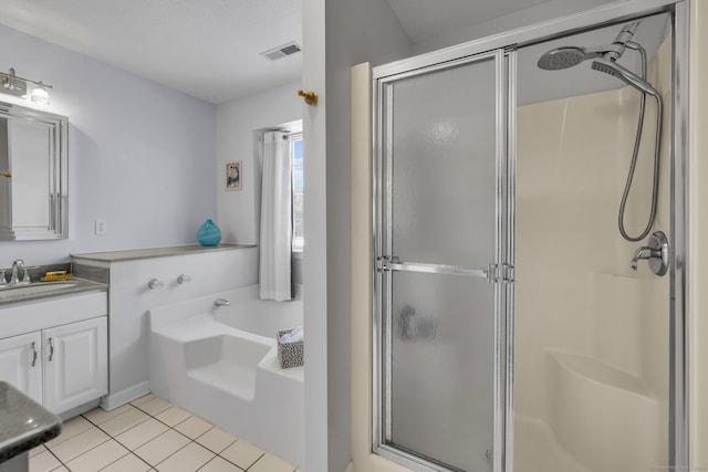 bathroom with tile patterned flooring, visible vents, vanity, a shower stall, and a bath