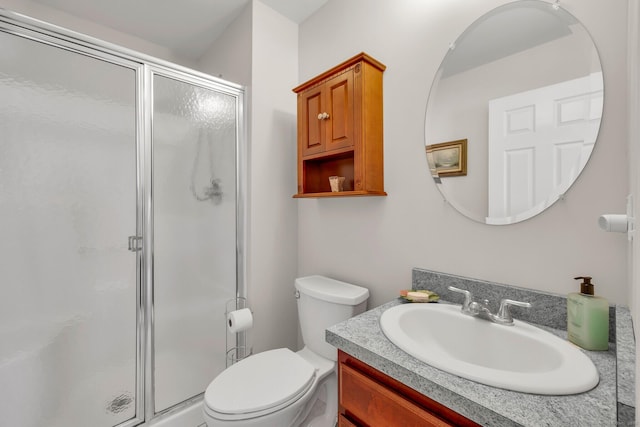 full bath with toilet, a shower stall, and vanity