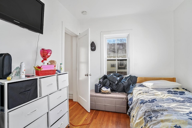 bedroom with hardwood / wood-style floors