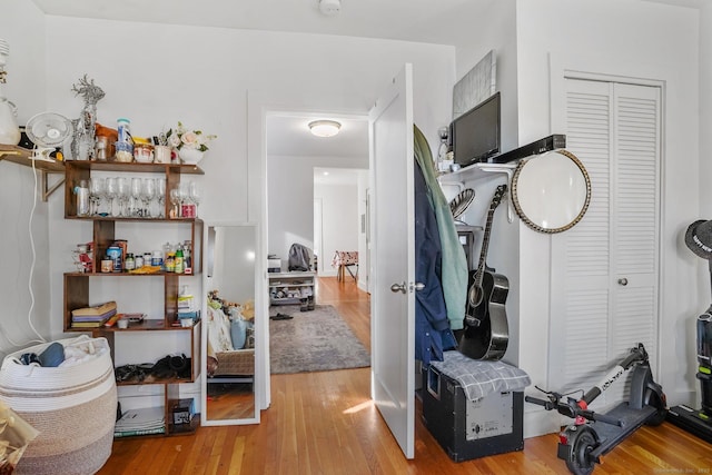 exercise room with hardwood / wood-style flooring