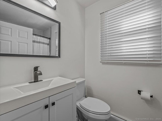 bathroom with vanity, a shower with curtain, and toilet