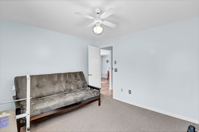 living area featuring ceiling fan and carpet floors