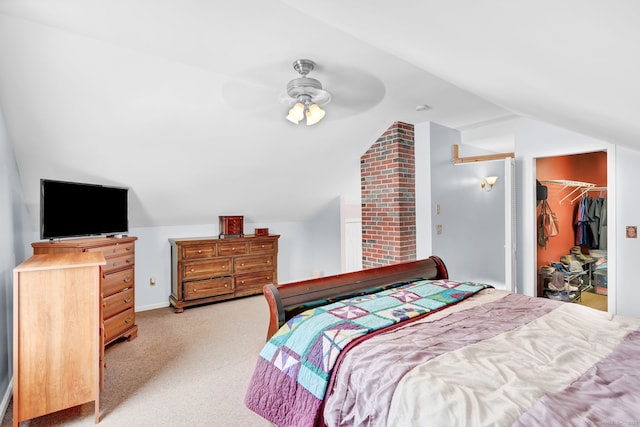 bedroom featuring vaulted ceiling, light colored carpet, and ceiling fan