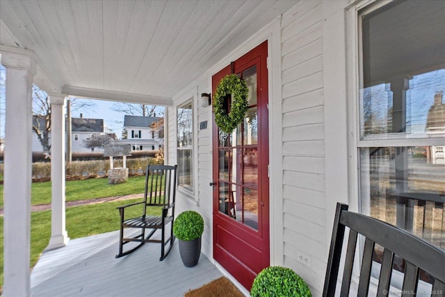 exterior space with a lawn and a porch