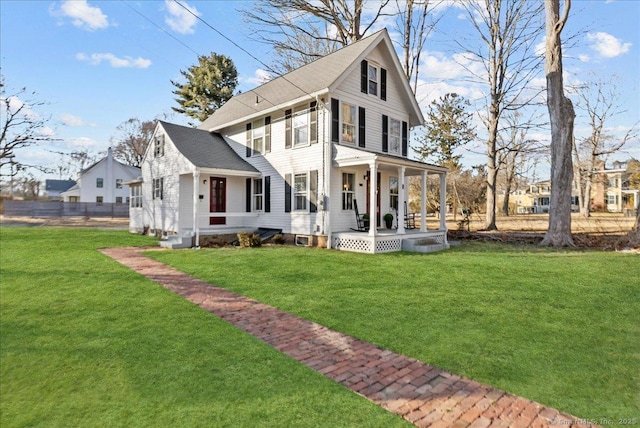 exterior space with a porch and a front lawn