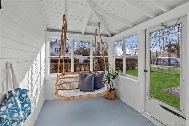 sunroom with lofted ceiling with beams and wooden ceiling