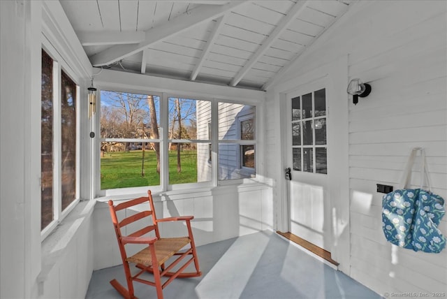 sunroom / solarium featuring wood ceiling and vaulted ceiling with beams