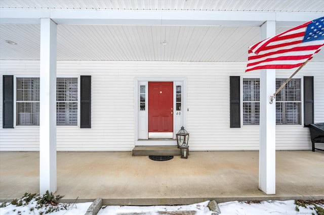 view of snow covered property entrance