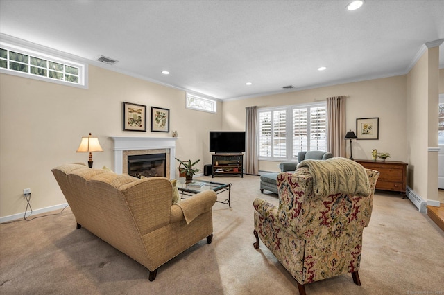 living room featuring a tile fireplace, a baseboard heating unit, light colored carpet, and crown molding