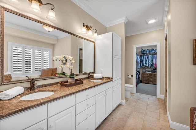 bathroom featuring tile patterned floors, vanity, toilet, and ornamental molding