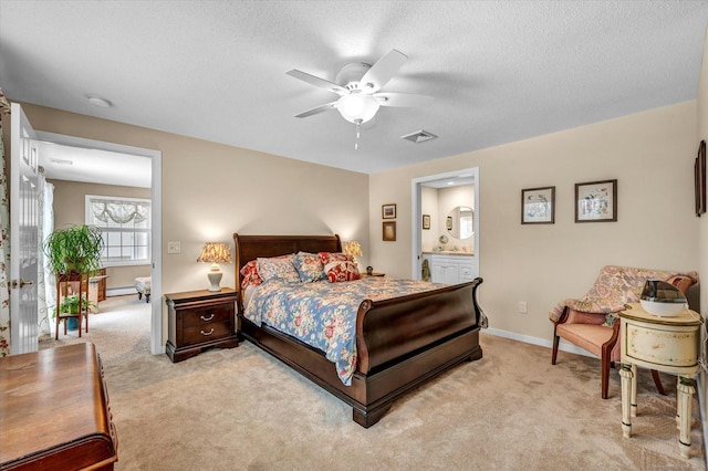 carpeted bedroom featuring ceiling fan, a baseboard radiator, ensuite bathroom, and a textured ceiling