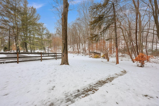 view of yard layered in snow