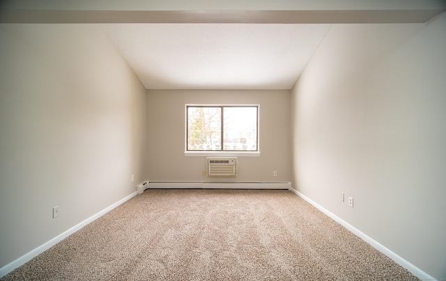 unfurnished room featuring a baseboard radiator, light colored carpet, and an AC wall unit