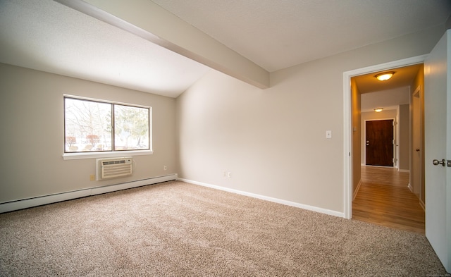 unfurnished room featuring carpet floors, a baseboard radiator, a wall mounted AC, and beamed ceiling