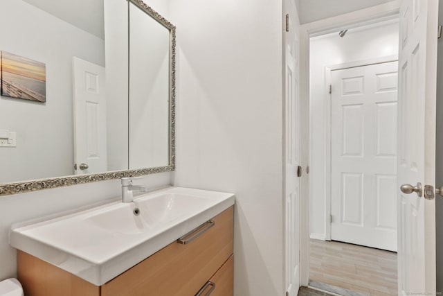 bathroom featuring vanity and hardwood / wood-style flooring