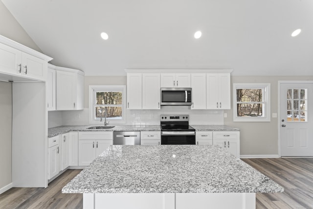 kitchen featuring a center island, white cabinets, and appliances with stainless steel finishes