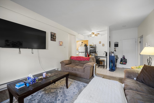 living room featuring light wood-type flooring and ceiling fan