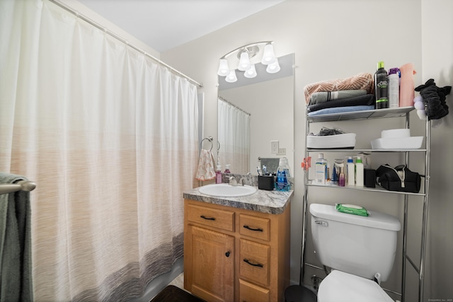 bathroom featuring vanity and toilet