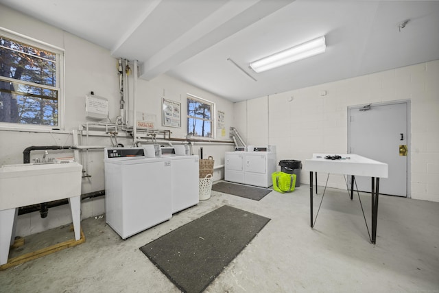 washroom featuring independent washer and dryer and sink