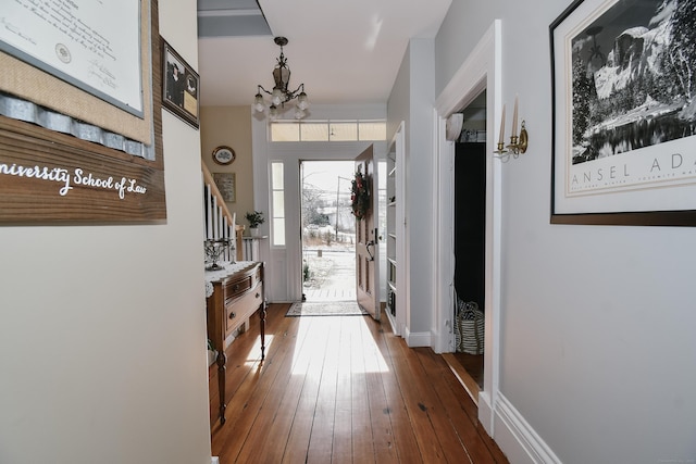 interior space with hardwood / wood-style flooring and a chandelier