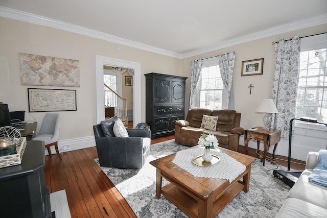 living room with ornamental molding and hardwood / wood-style floors