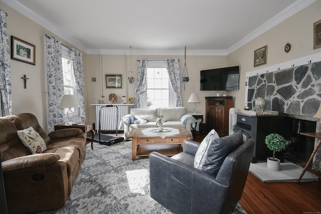 living room featuring hardwood / wood-style flooring, ornamental molding, and radiator heating unit