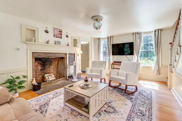 living room with a wealth of natural light and light wood-type flooring