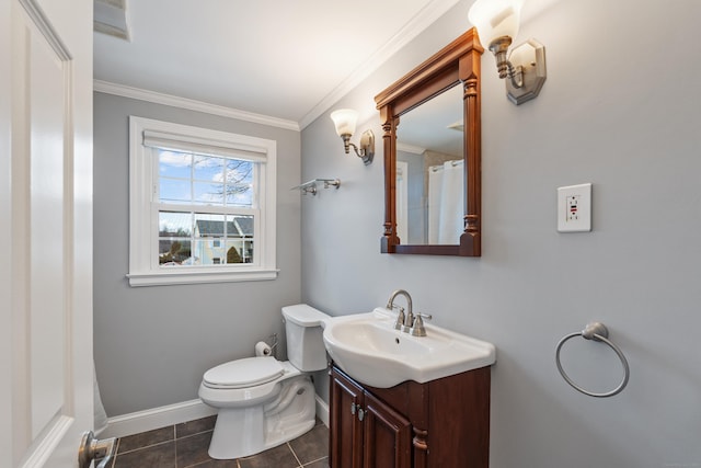 bathroom featuring vanity, tile patterned floors, crown molding, and toilet