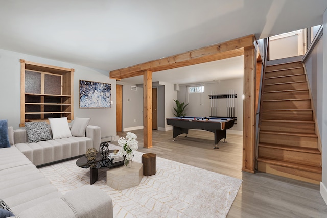 living room with pool table, light hardwood / wood-style flooring, and a baseboard radiator