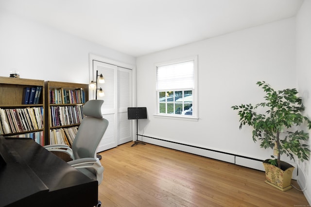 office area featuring hardwood / wood-style flooring and a baseboard radiator