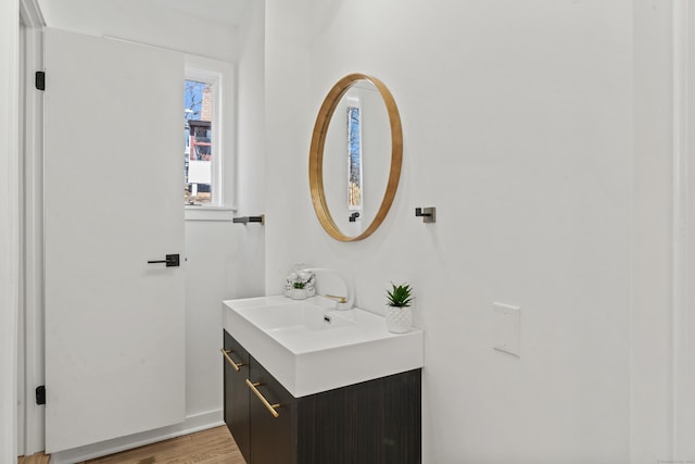 bathroom featuring vanity and hardwood / wood-style floors