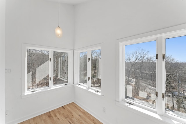 unfurnished sunroom with a healthy amount of sunlight